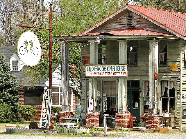 Two Frog son a Bike Antique Shop